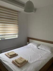 Ένα ή περισσότερα κρεβάτια σε δωμάτιο στο Apartman 13
