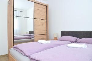 Ένα ή περισσότερα κρεβάτια σε δωμάτιο στο Apartman RIO