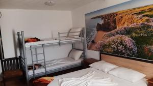 Postel nebo postele na pokoji v ubytování Casa Bucuria Henri Coanda