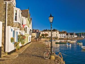 a bike parked next to a street light next to the water at Flat 1, 32 Newcomen Road in Dartmouth