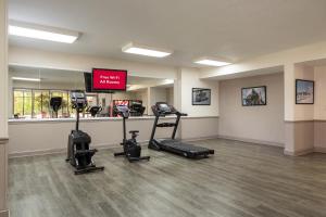 a gym with treadmills and machines in a room at Red Roof Inn & Suites Jacksonville, NC in Jacksonville