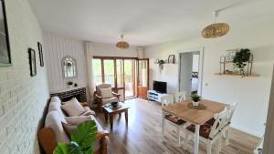 a living room with a couch and a table at Apartamento Mirador Valdeiglesias in Pelayos de la Presa