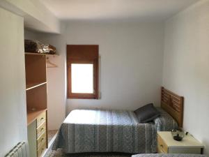 Łóżko lub łóżka w pokoju w obiekcie Casa Collado