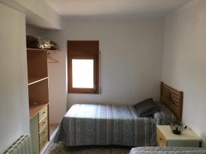 Łóżko lub łóżka w pokoju w obiekcie Casa Collado