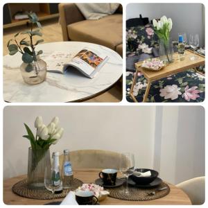 einen Tisch mit einer Blumenvase und einem Tisch mit Brille in der Unterkunft Apartament Gold in Giżycko