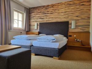 Postel nebo postele na pokoji v ubytování Aktivhotel Föttinger
