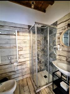 a bathroom with a shower and a sink at L' Onda di Manarola in Manarola