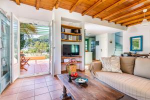 a living room with a couch and a table at Myrto's House at Agnontas in Agnontas