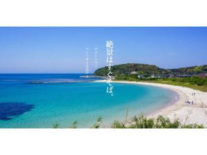 a view of a beach with a boat in the water at Pensione Shimado - Vacation STAY 37555v in Shimonoseki