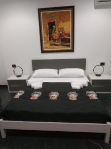 Tempat tidur dalam kamar di Case vacanze donna Ina
