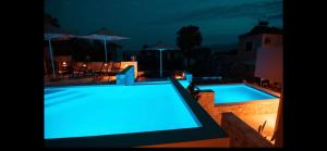 The swimming pool at or close to Dimani Suites