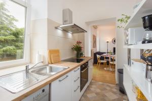 Kuchyňa alebo kuchynka v ubytovaní Apartman Lussi