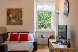 Televízia a/alebo spoločenská miestnosť v ubytovaní Apartman Lussi