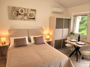 Ένα ή περισσότερα κρεβάτια σε δωμάτιο στο Apartmani Tamarut