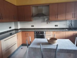 a kitchen with a table with a bowl on it at Casa da Pioxa in Camariñas