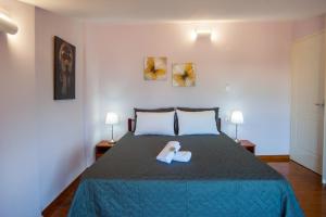 Ένα ή περισσότερα κρεβάτια σε δωμάτιο στο Nicopolis Villa1