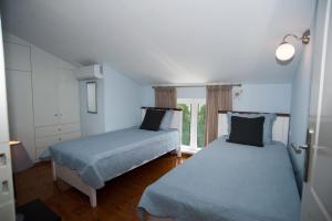 Postel nebo postele na pokoji v ubytování Nicopolis Villa1