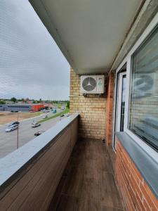 a balcony with a window and a air conditioner at 2-bedrooms apartment in city center Šiauliai in Šiauliai