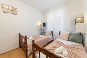 Postel nebo postele na pokoji v ubytování Apartman Porto
