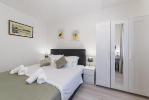 Posteľ alebo postele v izbe v ubytovaní Apartman Porto