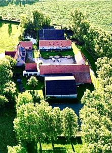 an overhead view of a school with trees and buildings at Paardenhof Guesthouse in Esquelbecq