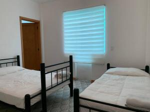 Postel nebo postele na pokoji v ubytování 1C TU CASA CENTRO CDMX CONFORTABLE