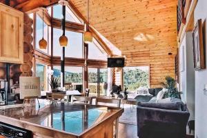 a living room with a glass counter in a house at Cozy Cabin Rental in Pine Mountain Club California in Frazier Park