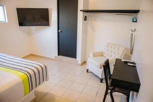 TV a/nebo společenská místnost v ubytování Donjuan By Melida Hotel