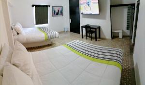 Postel nebo postele na pokoji v ubytování Donjuan By Melida Hotel