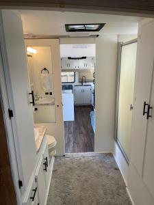 a bathroom with a toilet and a sink at RV2 Stunning RV Private Netflix FreeParking in Moreno Valley
