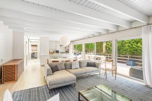 a living room with a couch and a table at White Sandstone in Amagansett