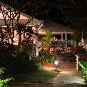 a group of people sitting at a restaurant at night at Club Seabourne Hotel in Culebra