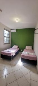 Ένα ή περισσότερα κρεβάτια σε δωμάτιο στο BALSAMO HOTEL