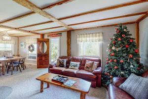 a living room with a christmas tree in it at Town Farm Retreat in Ludlow