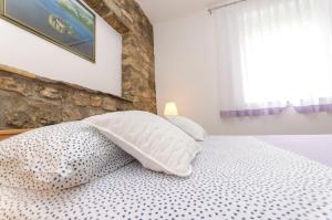 Postel nebo postele na pokoji v ubytování Apartment Luka