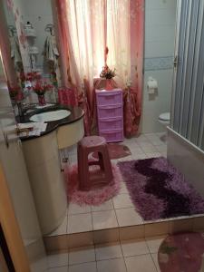 a bathroom with a sink and a toilet at Bed fiorella in Acciaroli