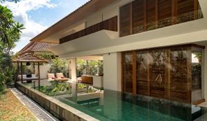 an image of a house with a swimming pool at Bisma Eight Villas in Ubud