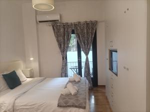 Posteľ alebo postele v izbe v ubytovaní Elegant Apartment