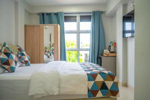 Postel nebo postele na pokoji v ubytování Tour Inn