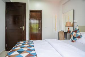 Postel nebo postele na pokoji v ubytování Tour Inn