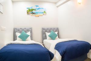 Postel nebo postele na pokoji v ubytování Tour Inn