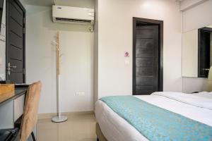 Postel nebo postele na pokoji v ubytování Tour Inn