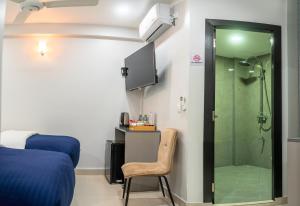 TV a/nebo společenská místnost v ubytování Tour Inn
