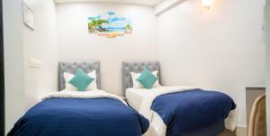 Postel nebo postele na pokoji v ubytování Tour Inn