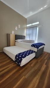 A bed or beds in a room at GRAND NALA JATIMPARK BATU