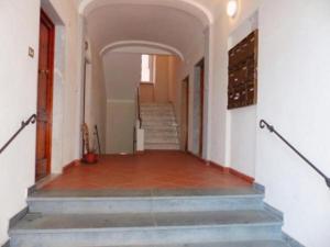 an empty hallway with stairs in a building at Appartamento e Mansarda al mare in Rio Marina +1 photo