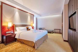 Voodi või voodid majutusasutuse Shenzhen Avant-Garde Hotel toas