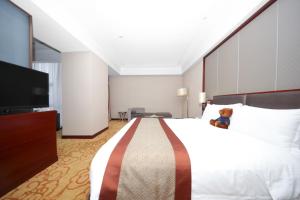 Voodi või voodid majutusasutuse Shenzhen Avant-Garde Hotel toas