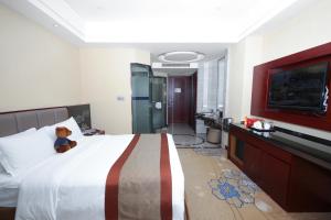 Voodi või voodid majutusasutuse Shenzhen Avant-Garde Hotel toas