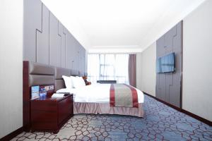 Voodi või voodid majutusasutuse Shenzhen Avant-Garde Hotel toas